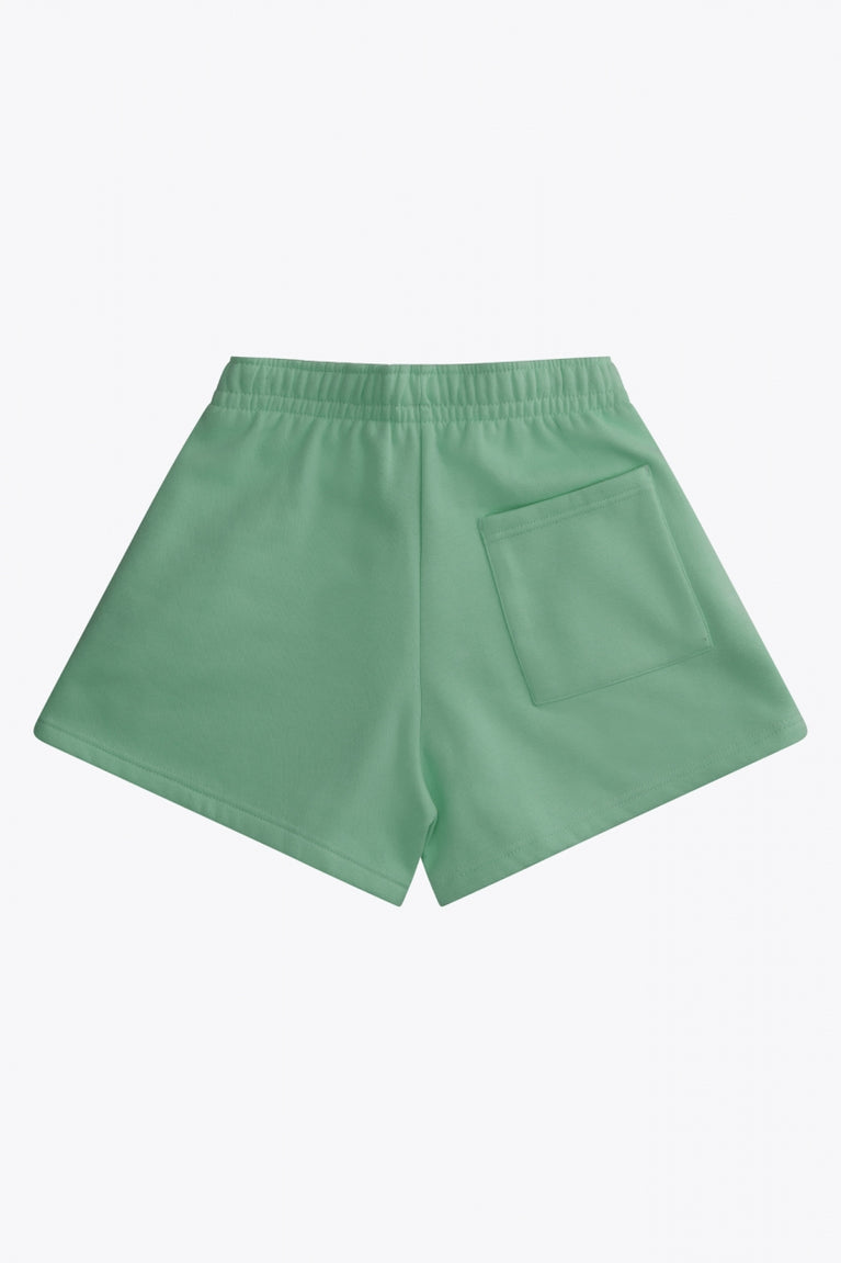 Osaka women shorts in green with logo in white. Back flatlay view