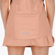 Woman wearing the Osaka women singlet in peach with logo in grey. Back view