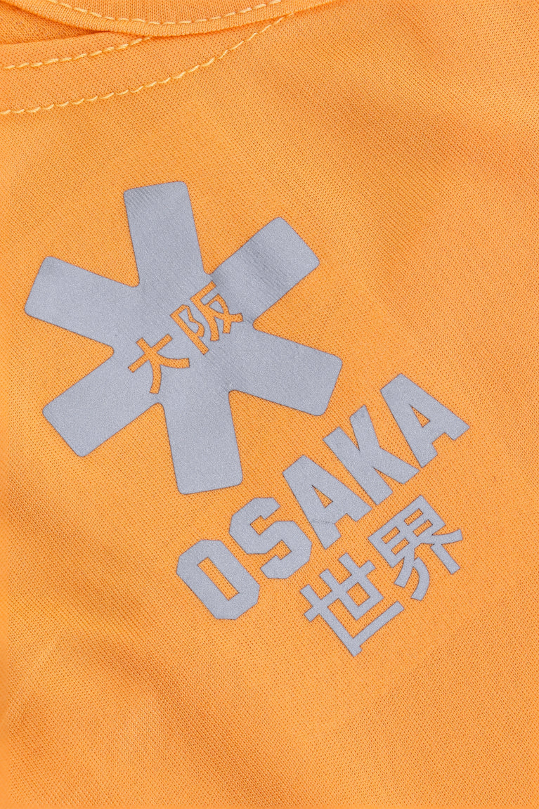 Osaka women singlet in orange with logo in grey. Detail logo view