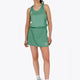 Woman wearing the Osaka women singlet in green with logo in grey. Front view