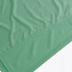 Osaka women singlet in green with logo in grey. Front flatlay detail view