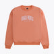 Osaka women sweater in peach with logo in white. Front flatlay view