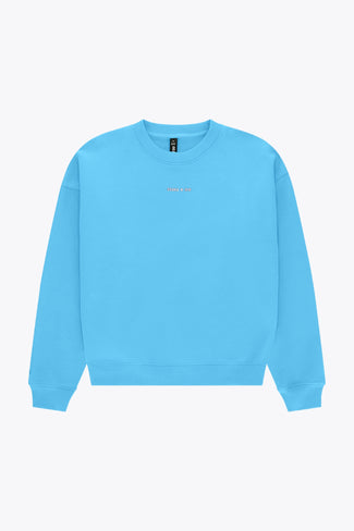 Osaka women sweater in light blue with logo in white. Front flatlay view