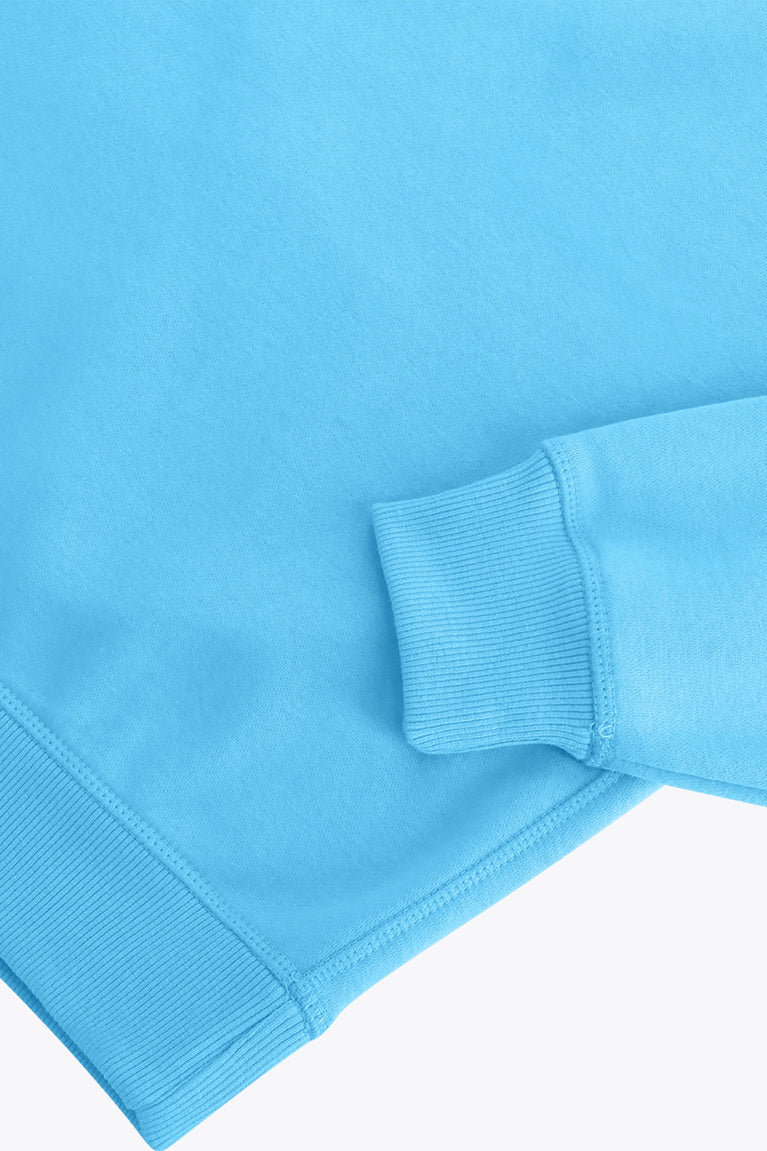 Osaka women sweater in light blue with logo in white. Front flatlay detail sleeve view