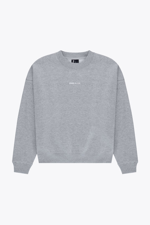 Osaka women sweater in heather grey with logo in white. Front flatlay view
