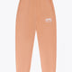 Osaka women sweatpants in peach with logo in white. Front flatlay view