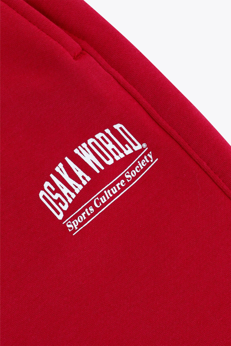 Osaka women sweatpants in red with logo in white. Front flatlay detail logo view