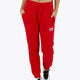 Woman wearing the Osaka women sweatpants in red with logo in white. Front view