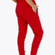 Woman wearing the Osaka women sweatpants in red with logo in white. Back view