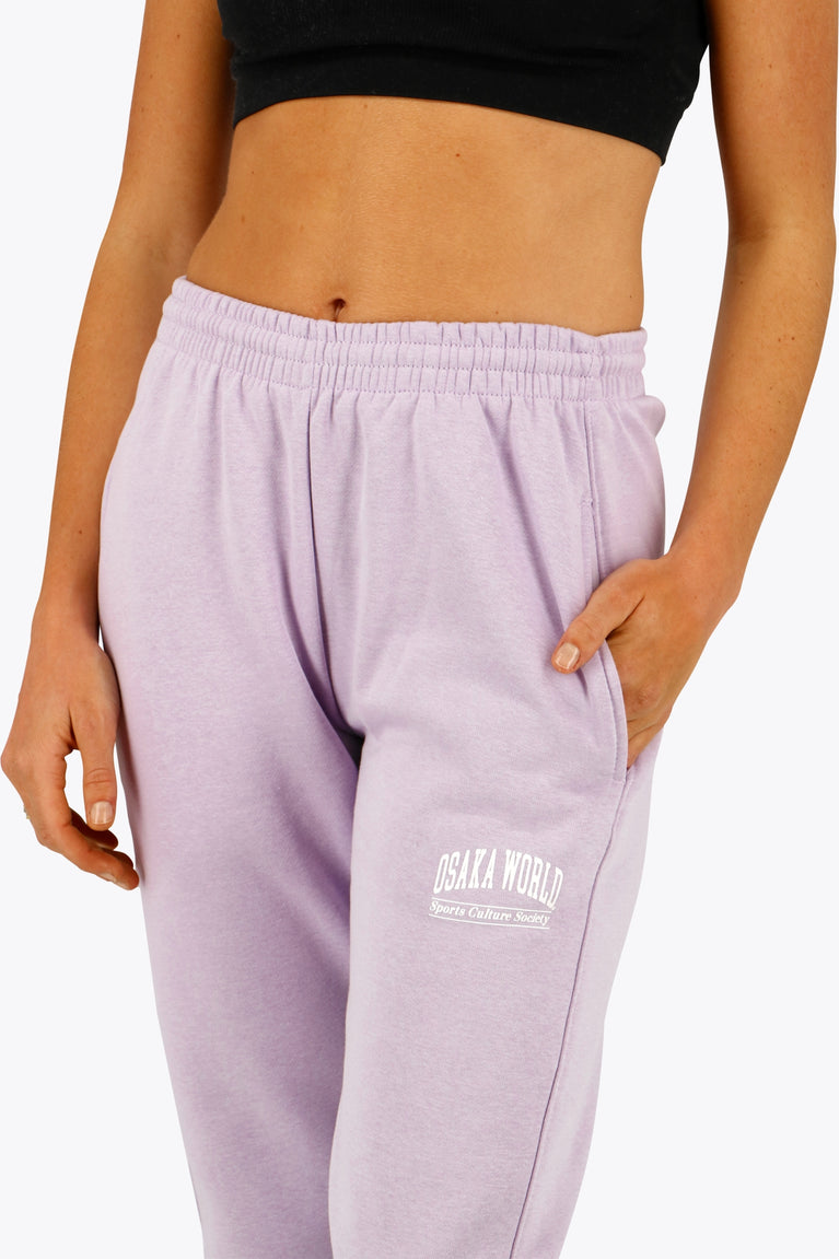 Osaka women sweatpants in light purple with logo in white. Front detail view