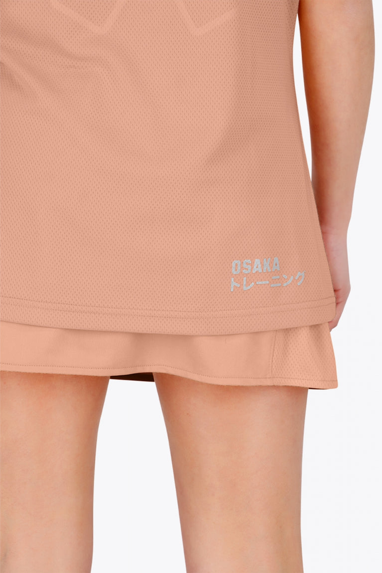 Osaka women tee short sleeve in peach with logo in grey. Back detail logo view