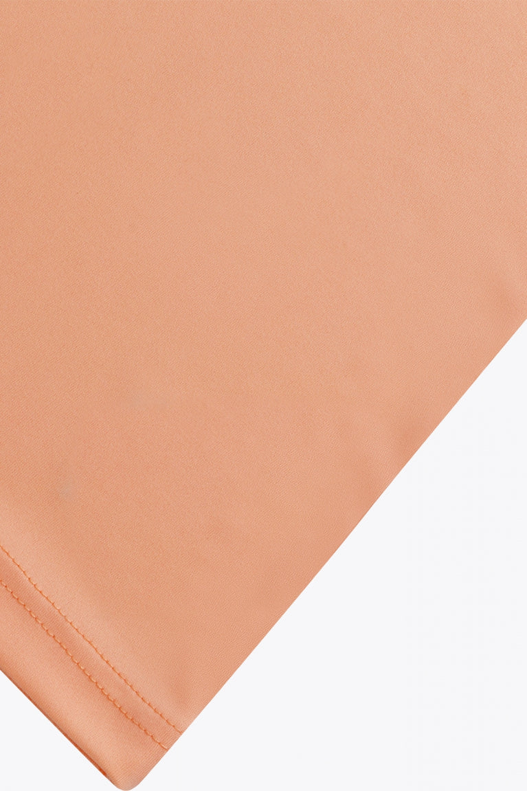 Osaka women tee short sleeve in peach with logo in grey. Detail fabric view