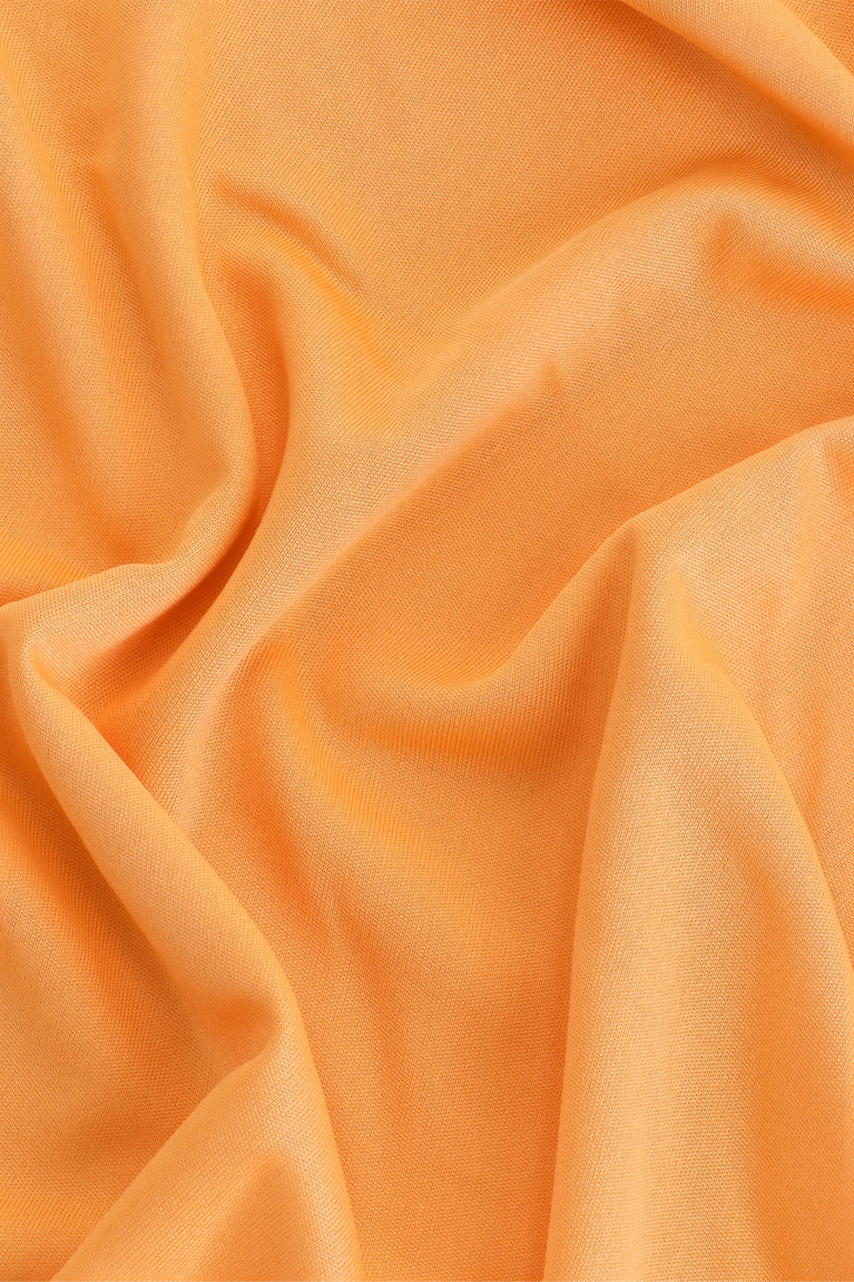 Osaka women tee short sleeve in orange with logo in grey. Detail fabric view