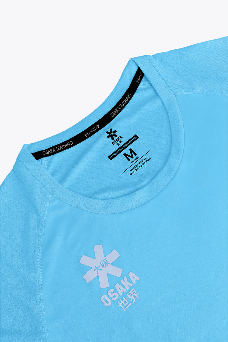 Osaka women tee short sleeve in light blue with logo in grey. Front flatlay detail view