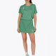 Woman wearing the Osaka women tee short sleeve in green with logo in grey. Front view