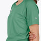 Woman wearing the Osaka women tee short sleeve in green with logo in grey. Side view