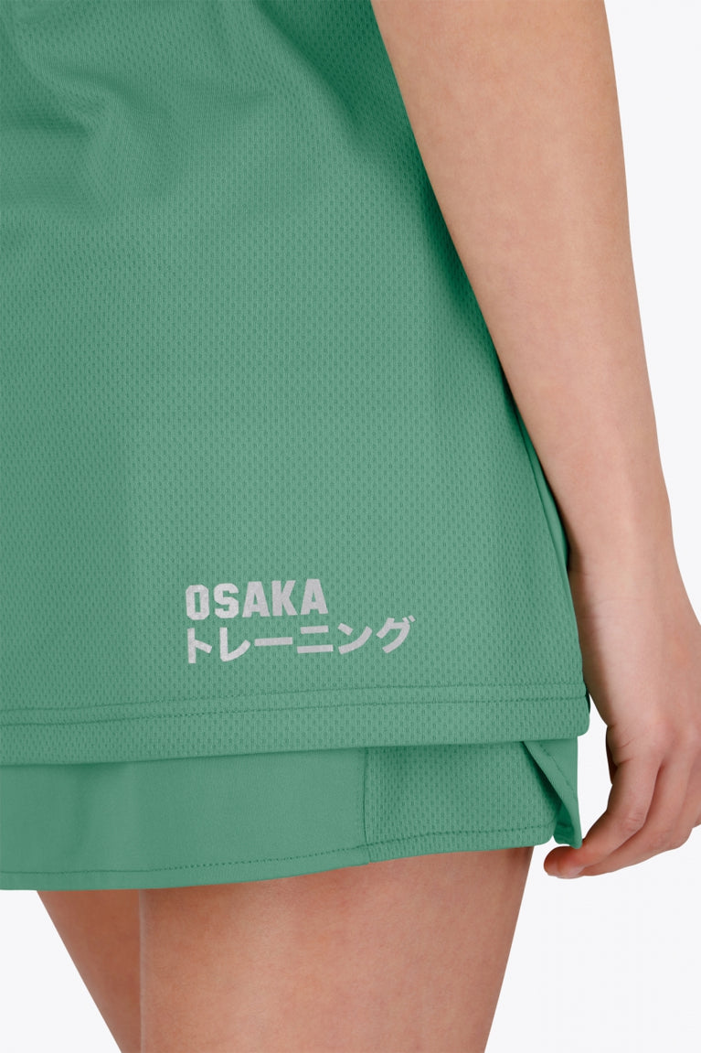 Osaka women tee short sleeve in green with logo in grey. Back detail logo view