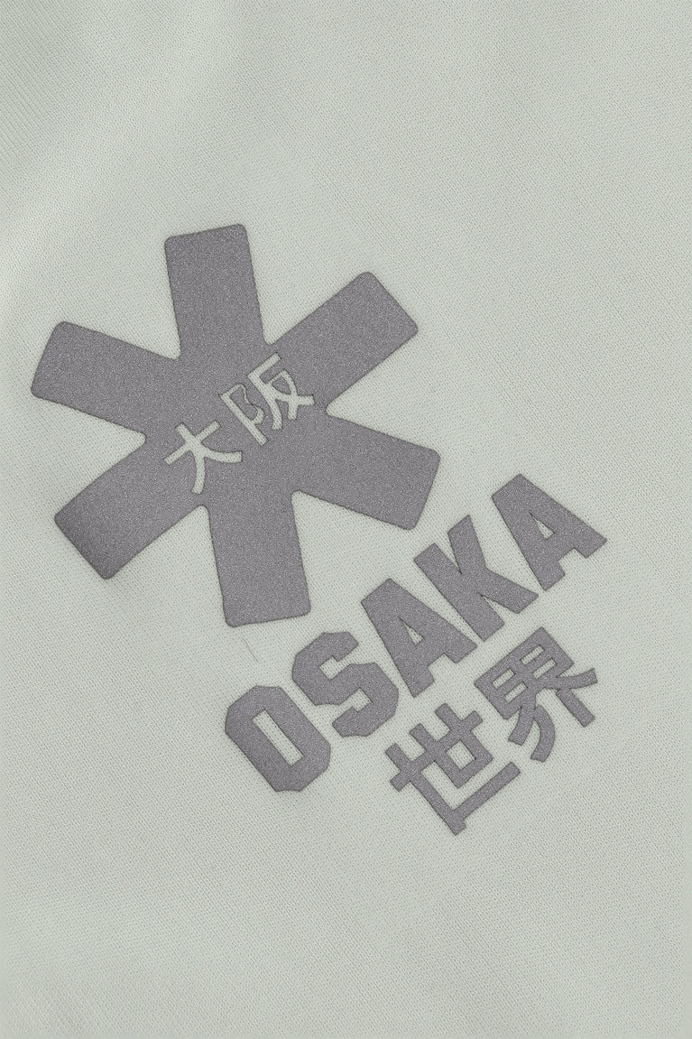 Osaka women tee short sleeve in light grey with logo in grey. Detail logo view