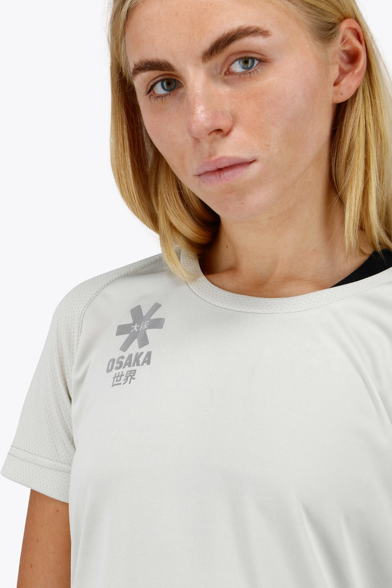 Osaka women tee short sleeve in light grey with logo in grey. Front detail logo view