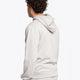Man wearing the Osaka basic unisex hoodie in grey with green logo on it. Back side view