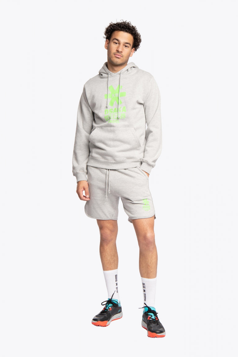 Man wearing the Osaka basic unisex hoodie in grey with green logo on it. Front full view
