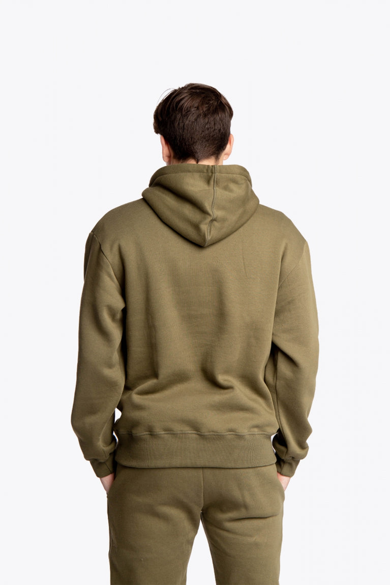 Boy wearing the Osaka unisex hoodie in army green with college initials in yellow. Back view