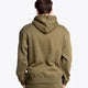 Boy wearing the Osaka unisex hoodie in army green with college initials in yellow. Back view