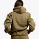 Girl wearing the Osaka unisex hoodie in army green with college initials in yellow. Back view