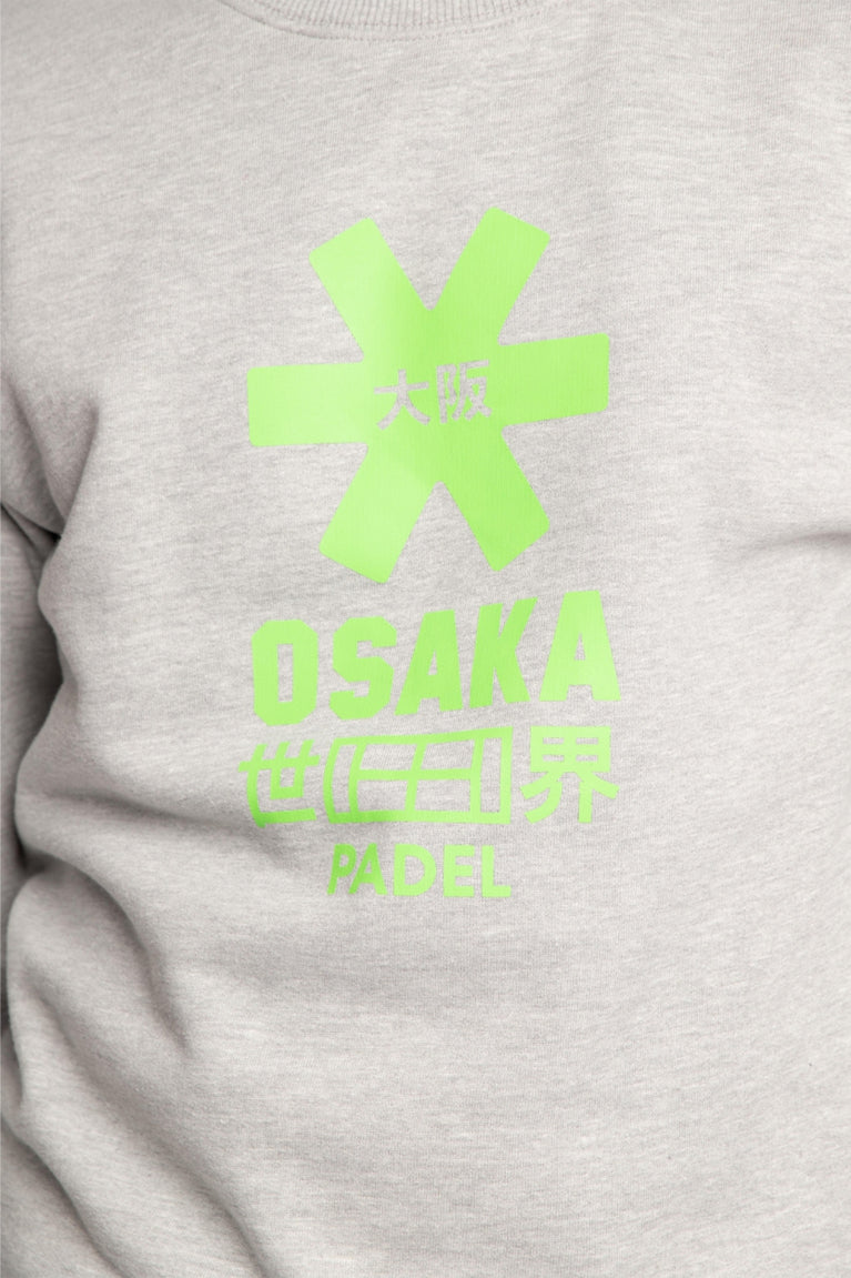 The Osaka grey unisex sweater with green logo. Front detail logo view