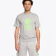 Man wearing the Osaka unisex tee in heather grey with green logo. Front view