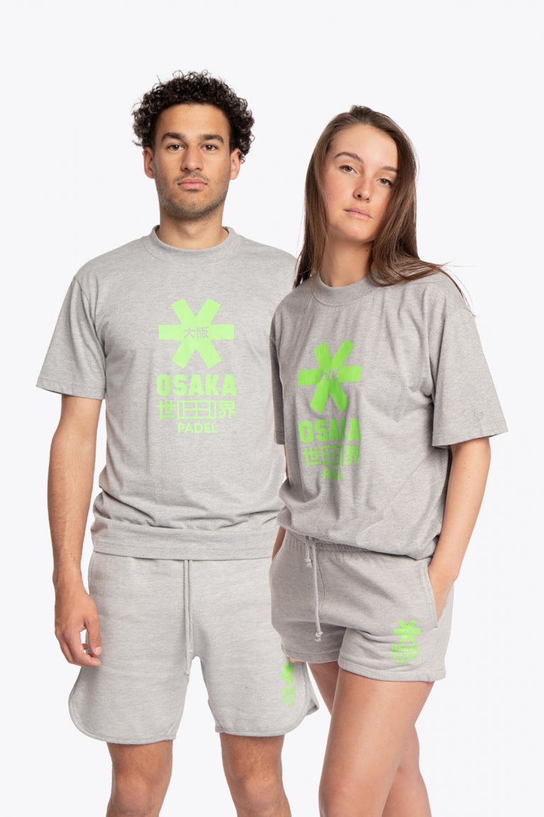 Man and woman wearing the Osaka unisex tee in heather grey with green logo. Front view