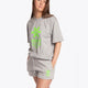 Woman wearing the Osaka unisex tee in heather grey with green logo. Front view