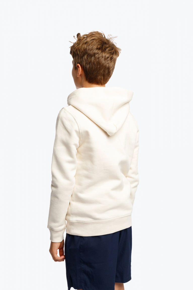 Boy wearing the Osaka kids hoodie in natural raw with college letters in orange and logo in blue. Back view
