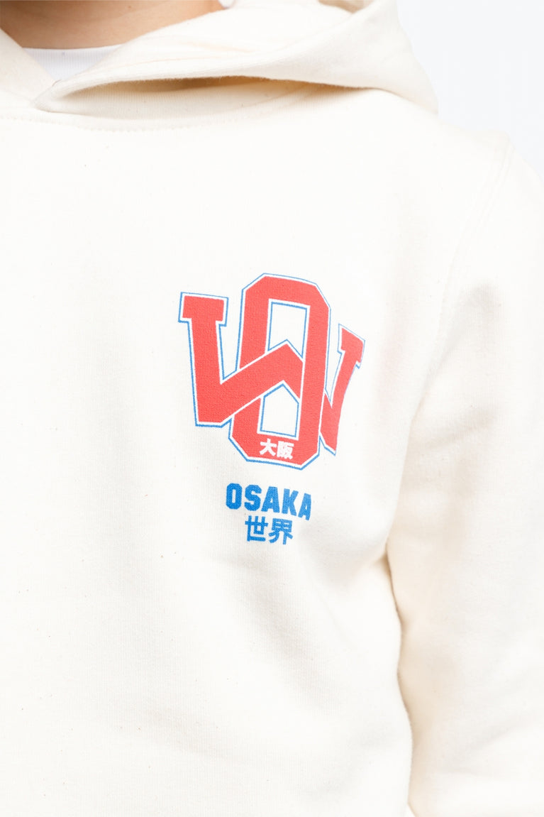 Osaka kids hoodie in natural raw with college letters in orange and logo in blue. Detail view of the letters and logo