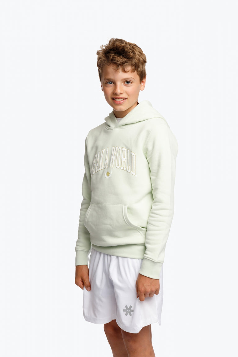 Boy and girl wearing the Osaka kids hoodie in mint green with logo in college letters in white. Front view