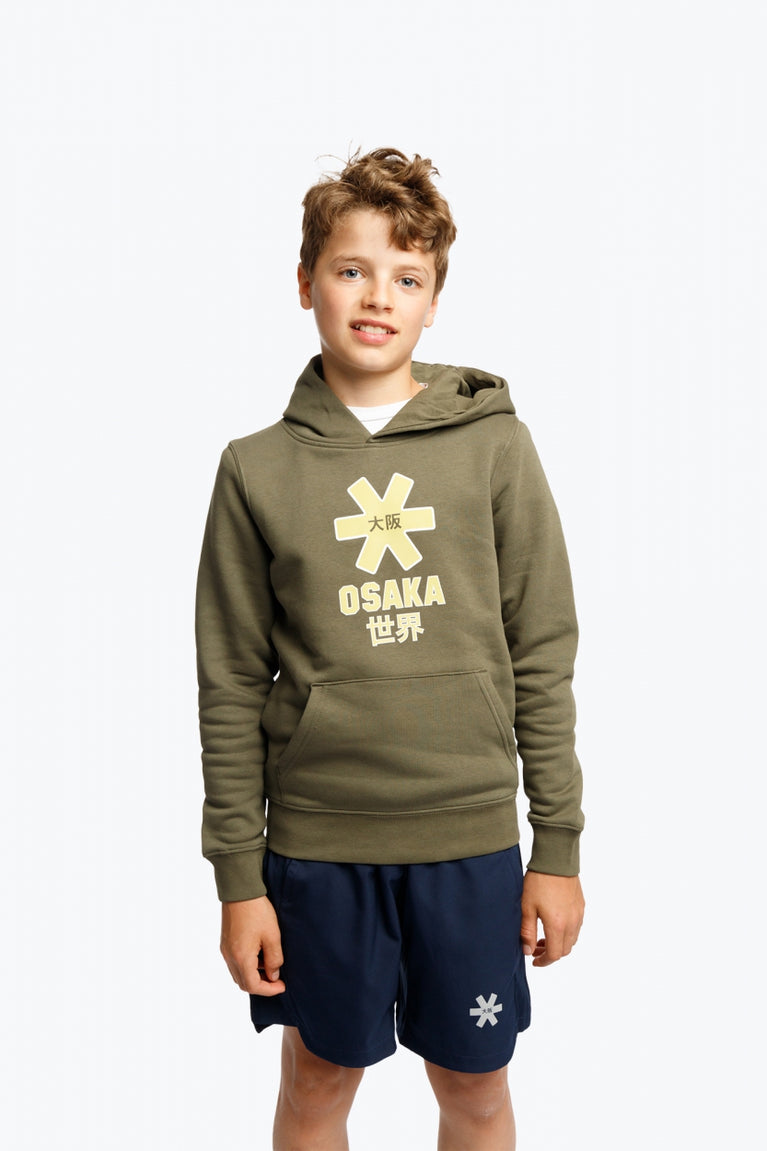 Boy wearing the Osaka kids hoodie in khaki with yellow logo. Front view