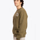 Man wearing the Osaka x Buenas Open sweater in army green. Side view