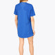 Woman wearing the Osaka women v-neck tech dress in princess blue with logo in grey. Back view
