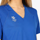Woman wearing the Osaka women v-neck tech dress in princess blue with logo in grey. Front detail logo view