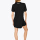 Woman wearing the Osaka women v-neck tech dress in black with logo in grey. Back view