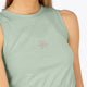 Woman wearing the Osaka women tech tank top in jadeite with logo in grey. Front view