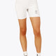 Woman wearing the Osaka women tech short thights in white with grey logo. Front view