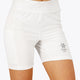 Woman wearing the Osaka women tech short thights in white with grey logo. Front view