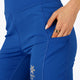 Woman wearing the Osaka women tech short thights in princess blue with grey logo. Front detail pocket view