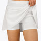 Woman wearing the Osaka women floucy skort white with logo in grey. Front detail short view