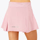 Woman wearing the Osaka women floucy skort pink with logo in grey. Back view