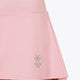 Woman wearing the Osaka women floucy skort pink with logo in grey. Front detail logo view