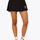 Woman wearing the Osaka women floucy skort black with logo in grey. Front view