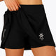 Woman wearing the Osaka women floucy skort black with logo in grey. Front detail view