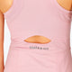 Woman wearing the Osaka women floucy dress pink with logo in grey. Back detail open back view